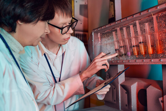 Scientists explore mysterious alien technology in a high tech lab environment