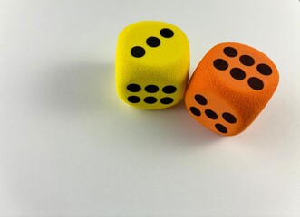 Yellow and Orange Foam Dice with Copy Space for Gaming and Risk Concept