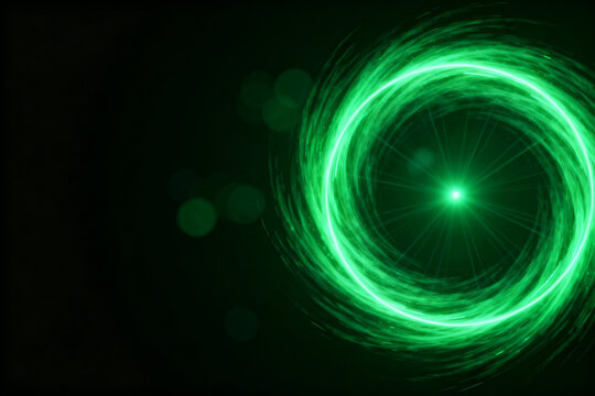 Green light spiral on dark background