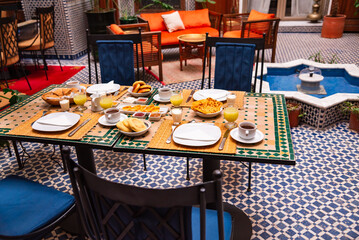 Traditional breakfast in Morocco with oranges and arabic bread