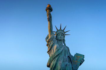 Tokyo, Japan - Oct 13 2024, Panoramic view of the Tokyo Statue of Liberty on embankment on Odaiba Island, with a blue sky on background, at daytime, Tokyo, Japan