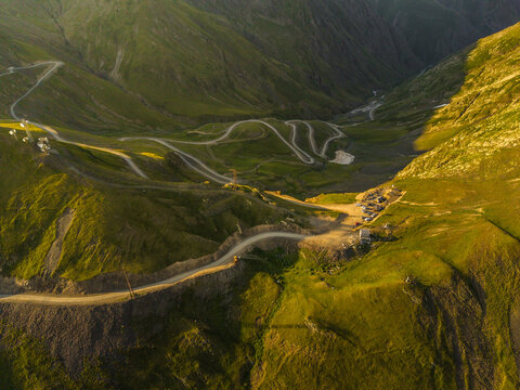 Aerial view of winding roads cutting through the verdant hills of Alazani Pass, Chala, Kakheti, Georgia.
