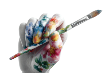 Hand holding a paintbrush with flowers