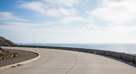 Fototapeta premium Curving coastal highway with ocean view and cloudy sky