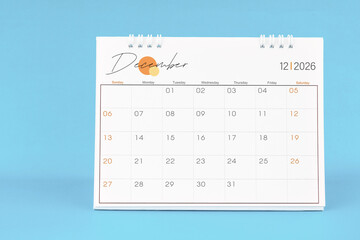 December 2026, Monthly desk calendar for 2026 year on Blue color background.