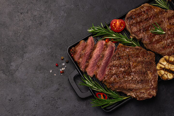 sliced grilled medium rare ribeye steaks