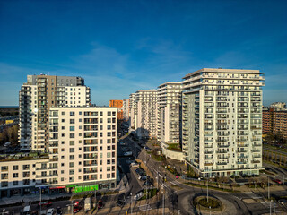 High-angle drone panorama of Przymorze city blocks at sunrise, wide composition, soft light, HDR effect for editorial travel photo