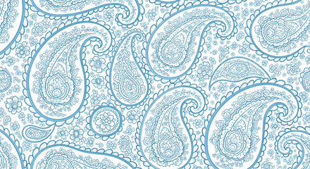 A detailed close-up of intricate blue and white paisley pattern fabric with a textured appearance.