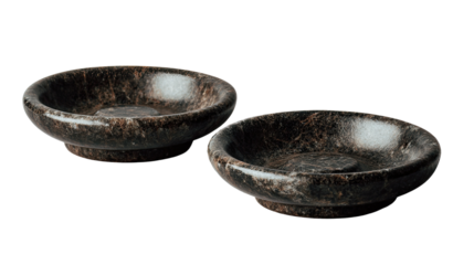 Two dark-veined stone bowls, shallow and round