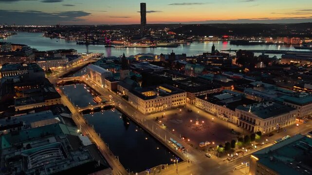 Gotheborg skyline at sunset showcasing city lights and waterfront beauty. Aerial evening shot of Gotheborg city center, Sweden