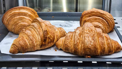 several croissants, a type of flaky, buttery pastry. Delicious freshly baked croissants placed on...