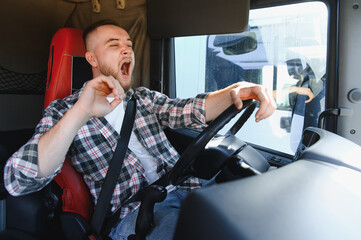 Truck driver yawning experiencing fatigue and drowsiness