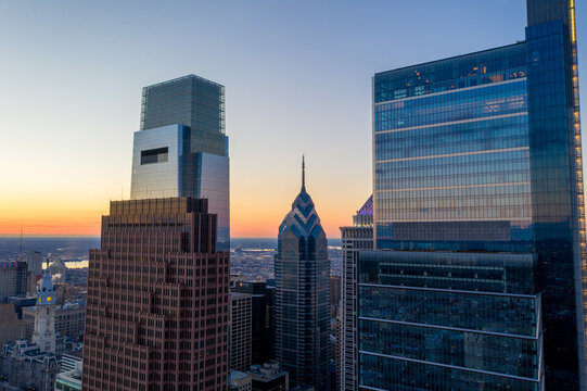 Aerial view of skyscrapers piercing the twilight sky, including the Comcast Technology Center and One Liberty Place, Philadelphia, Pennsylvania, United States.