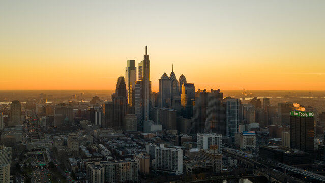 Aerial view of the Philadelphia skyline at sunset, with the Comcast Technology Center and One Liberty Place piercing the horizon, Philadelphia, Pennsylvania, United States.