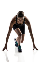 Focused Female Runner in Starting Blocks, Ready to Sprint
Determined Woman Athlete at Starting Line, Full-Body Studio Shot
Front View of Sprinter in Crouch Position, Ready for the Race