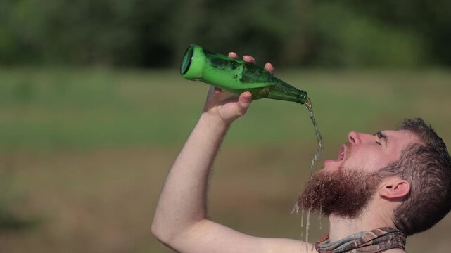 Drinking beer at the beach enthusiastically