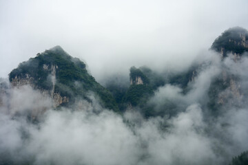 Misty peaks rise from the clouds in China.