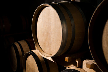Winery cellar interior with oak barrels arranged for fermentation.