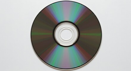 Retro technology visualization: an optical storage disc with beautiful, radiating rainbow light patterns on a white surface.