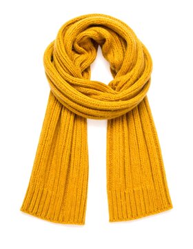 Cozy, mustard-colored, knitted scarf draped against a white backdrop