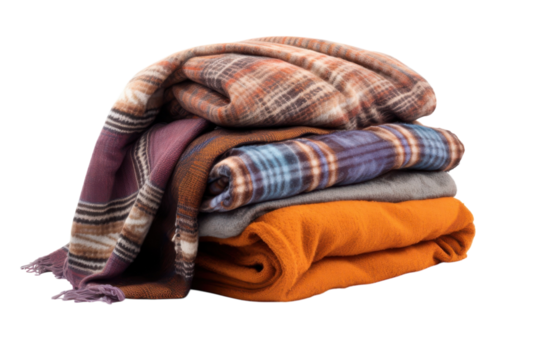 Stack of cozy blankets in various patterns and colors