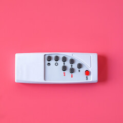 White remote control for various electrical appliances.