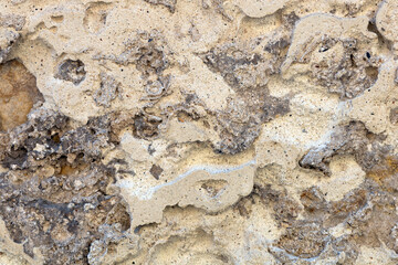 Antique masonry surface in sandy tones