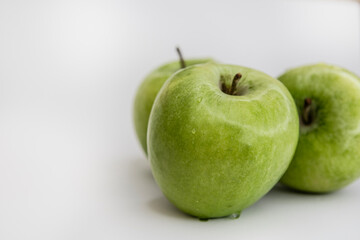 Flat Lay of Green Apples on White Background with Copy Space for Packaging and Labels