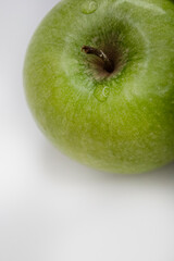 Minimal flat lay green apple on white background clean copy space eco branding template