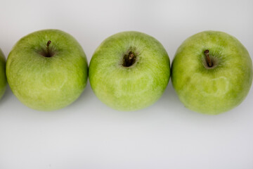 Flat Lay of Green Apples on White Background with Copy Space for Packaging and Labels