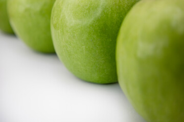 Luxury Minimalist Flat Lay of Green Apples in Diagonal Row on White Background with Copy Space