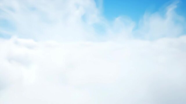 Abstract White Cloudscape - This video shows a blurred view of thick white clouds, seen from above with a slight hint of blue sky visible in the distance.