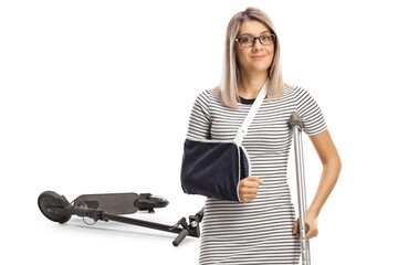 Electric scooter accident and injured woman with a broken arm