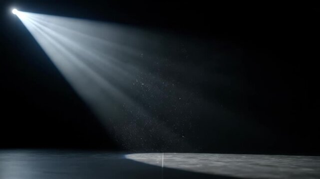Spotlight Illuminating Dark Room - A single bright spotlight shines down from the upper left corner onto a dark, empty room.