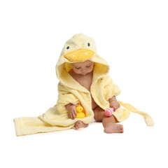 Cute baby in bathrobe playing with toys on white background