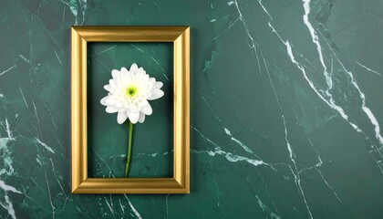 A close-up shot features a gold-framed white flower against a mottled, emerald-green background. The image evokes elegance and simplicity