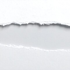 A close-up shot features torn white paper strips. The ripped edges frame a light-gray space, suggesting a peek or reveal