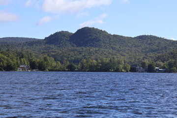 A panoramic view of a lake nestled in the Adirondacks.