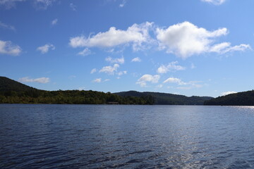 A panoramic view of a lake nestled in the Adirondacks.