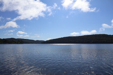 A panoramic view of a lake nestled in the Adirondacks.