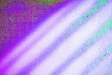 Colorful diagonal streaks of light create an abstract pattern. The hues shift from vivid purples to greens and whites.AI generated.