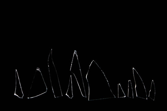 sharp-edged glass shards on a black background