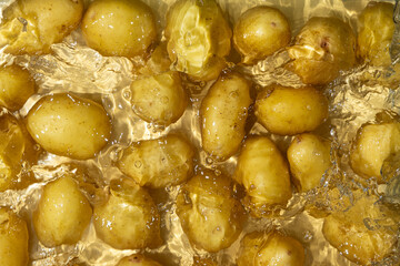 Fresh Organic Potatoes Immersed In Water With Splashing Effect.