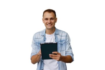 Smiling man in denim shirt looking at camera, holding digital tablet portraying connection and technology