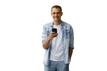 Smiling man wearing casual denim shirt and white t-shirt, holding smartphone, looking at camera, full body on transparent background