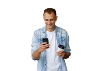 Man smiling while checking smartphone and holding takeaway coffee, enjoying technology and mobile communication