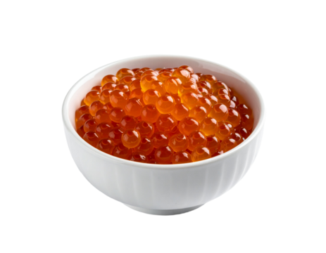 Close up of a small white bowl filled with bright orange spheres against a transparent background