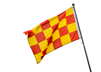 Red and yellow checkered flag waving against overcast sky