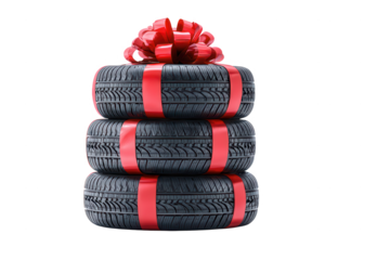 High quality photo of stacked tires wrapped as a gift with red ribbon and bow isolated on transparent background