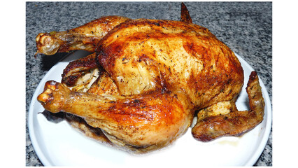 Delicious roasted whole chicken served on plate for dinner meal